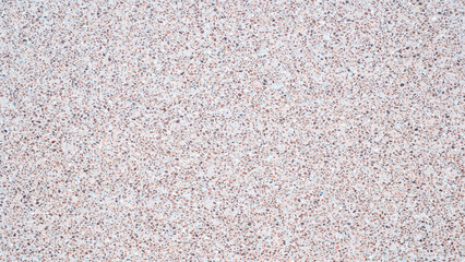 Poster - A background with a lot of different colored rocks scattered all over it. The rocks are of various sizes and colors, creating a visually interesting and unique pattern