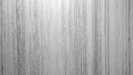 Aufkleber - A grey wall with a wood grain texture. The wall is covered in a pattern of lines and dots