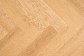 Poster - A wooden surface with a grain pattern. The wood is light brown and has a natural texture. The surface is smooth and has a warm, inviting feel