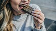 © Lalin T - Closeup woman eating chocolate
