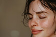 © MagnusCort - A close up of a woman after having a shower with her eyes closed looking to a side