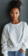 © BrandwayArt - Black Woman Posing in White Sweatshirt Against Grey Wall