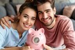 © mattegg - Joyful Couple Saving Money: Inserting Coins Into Piggy Bank