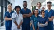 © Felippe Lopes - Diverse team of young healthcare professionals standing together in a modern medical facility, showcasing unity, confidence, and dedication to patient care.
