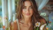 © Maxim Borbut - The Indian brunette woman is wearing western clothing and sitting on her balcony with some flowers. Indian lifestyle.