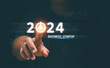 © krungchingpixs - Business startup concept. Businessman touch turn on icon for start new business on 2024. Planning and strategy business start and growth to success or rising successful development in the future.