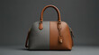 © naeem - A trendy and sophisticated women's handbag in brown and grey colour  presented in a minimalist style with a focus on its sleek design and details.