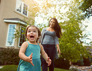 Excited, toddler and mother outdoor in backyard for play, fun and adventure on summer weekend. Young kid, happy and woman chasing in garden for explore environment, growth and development at home