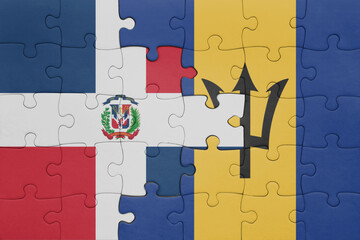 Wall Mural - puzzle with the colourful national flag of barbados and flag of dominican republic .