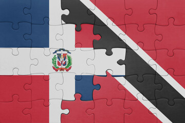 Wall Mural - puzzle with the colourful national flag of trinidad and tobago and flag of dominican republic .