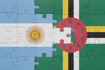 Wall Mural - puzzle with the colourful national flag of dominica and flag of argentina.