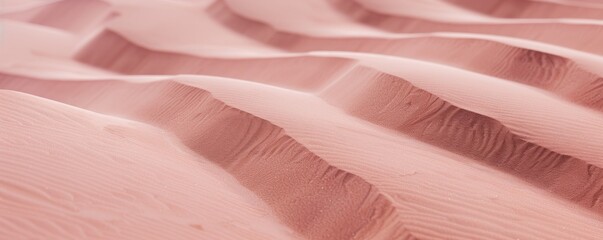 Wall Mural - Desert sand. Close-up view of desert sand with subtle pink hues color, showing delicate ripples and textures. The soft lighting accentuates intricate patterns, creating a serene captivating scene