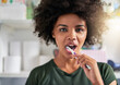 © peopleimages.com - Dental care, black woman and portrait with toothbrush in bathroom for hygiene, oral health and cavity prevention. Female person, teeth whitening and grooming in home for wellness and gum protection