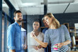 © N Hiraman/peopleimages.com - Woman, group and writing on glass at startup for notes, brainstorming and ideas for app in office. Business people, presentation and diversity in collaboration, thinking or board at web design agency