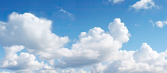 Poster - Afternoon sky filled with fluffy white clouds, ideal for a copy space image.