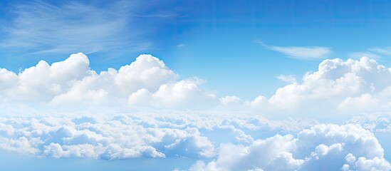 Poster - Scenic view of a clear blue sky featuring fluffy white clouds, ideal for using as a copy space image.