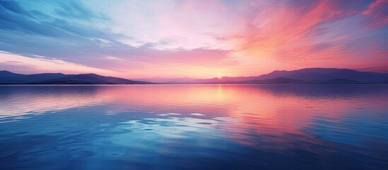 Wall Mural - A serene sunset over a tranquil lake with vibrant hues in the sky, captured in a high-quality copy space image.