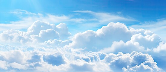 Aufkleber - The blue sky with fluffy white clouds provides a serene backdrop for the copy space image.