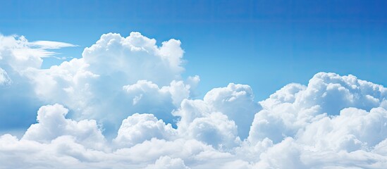 Poster - Cloudy weather with cumulus clouds creates an abstract backdrop suitable for design projects with copy space image.