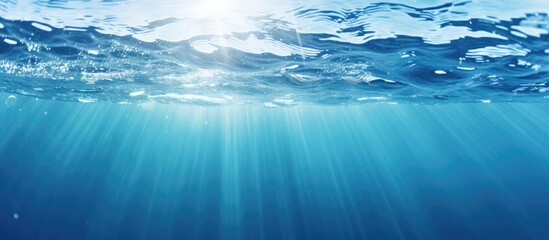 Poster - Blurry blue clear water with ripples and bubbles, featuring a shining pattern texture background, ideal for a copy space image.