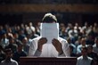 © darshika - Fearful young lecturer hides face with paper on podium.