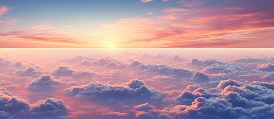 Wall Mural - Sunset sky viewed from an airplane with white clouds, perfect for a copy space image.