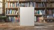 © Gita - A blank book standing on a wooden table in front of a blurred bookshelf, perfect for cover design presentations and marketing materials.  mockup