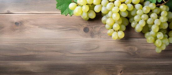 Poster - White table grapes on a rustic wooden background with copy space image.
