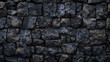 © Vita - Dungeon stone wall of ancient castle or fortress with weathered and cracked bricks in close up view.  Century historical rock black stonewall background closeup view wallpaper