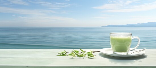 Sticker - iced greentea cup with sea background. Creative banner. Copyspace image