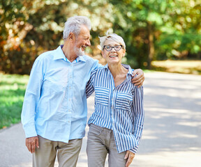 Wall Mural - woman man senior couple happy retirement together elderly active vitality park fun smiling love old nature wife happiness mature walking holding hands