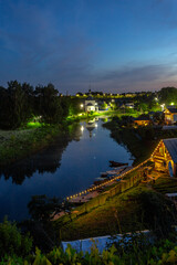 Wall Mural - Suzdal, Vladimir region, Russia, Golden Ring - View of the ancient Russian city from a height. The beautiful Kamenka River and the Church of the Epiphany on a summer evening.