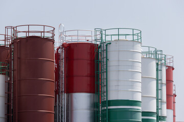 A row of tanks with red, white and green colors