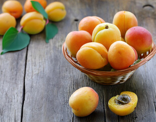 Poster - fresh organic apricots on wooden table