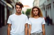 © MediaRaw - Two young people standing on a sidewalk, both wearing white t-shirts