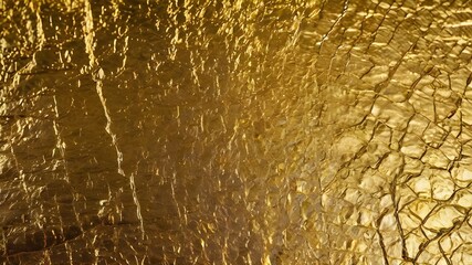 Gold texture. A brown surface with clear, detailed, raised patterns alternating with gold illustrations. Gold walls and backgrounds.