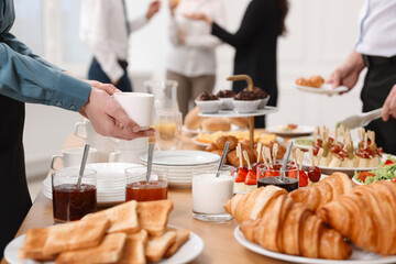 Poster - Coworkers having business lunch in restaurant, closeup