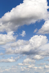Wall Mural - Blue sky with many white fluffy cumulus clouds texture, background