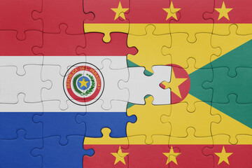Wall Mural - puzzle with the colourful national flag of grenada and flag of paraguay .