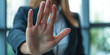 © IndigoElf - Stop, hand sign and woman in business suit with no gesture for sexual harassment and violence in office workplace