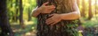 © JovialFox - Banner of Woman hugging a big tree in a park. Womens hands hugging a big tree in a forest. Meditation. Tree hugging. Close-up of hands hugging tree. Human and nature contact