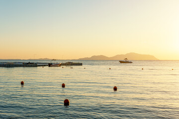 Canvas Print - View of calm beautiful sea during sunset. Holiday vacation and travel concept.