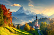 © Areesha - conic picture of Bavaria with Maria Gern church with Hochkalter peak on background. Fantastic autumn sunrise in Alps. Superb evening landscape of Germany countryside. Traveling concept ...