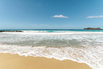 Wall Mural - Beautiful sandy beach on sea background.