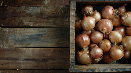 Wall Mural - Large, uncooked onions fill a container resting on a backdrop of natural-looking wood. Purposefully designed and captured from an aerial perspective.