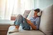 © Dragana Gordic - Little boy aged 6 listening to the music using modern tablet. The boy is wearing headphones and looking at tablet. Cute little boy with headphones and tablet listening to audiobook at home