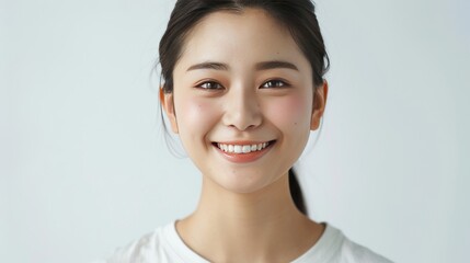 Wall Mural - Elegant Shot of a Joyful Young Woman, Emphasizing Skin Care Beauty, Cosmetic Radiance, and Dental Health Against a White background. 