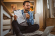© Miljan Živković - Adult man work from home and share document contract via video call