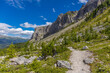 © Yuliia - Dolomiti Alps beautiful mountain landscape. Rocky tower alpine summits in the Dolomites. Summer mountain scenic view on the hiking trekking path in the green mountain valley and blue sky with clouds