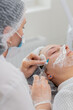 © Andrii Iemelianenko - Beauty anti-aging injections biorevitalization face cheek mesotherapy. Cosmetologist doctor making needle collagen injections syringe into skin of young woman girl. Lifting procedure therapy in clinic